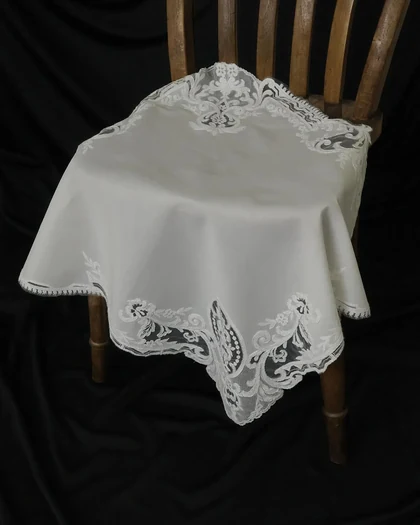 Lace-edged cloth draped over a wooden chair